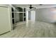 Spacious living room with modern tile flooring, recessed lighting, and a ceiling fan at 4104 N 113Th Ave, Phoenix, AZ 85037