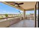 Balcony featuring scenic neighborhood views, ceiling fan and patterned railing at 4200 N Miller Rd # 504, Scottsdale, AZ 85251