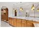 Bathroom features dual sinks with granite counters and decorative pendant lighting and walk-in closet at 4200 N Miller Rd # 504, Scottsdale, AZ 85251