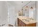 Bathroom with granite counters, dual sinks, and modern pendant lighting above the vanity at 4200 N Miller Rd # 504, Scottsdale, AZ 85251