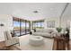 Bright living room features large windows, balcony, and modern furnishings at 4200 N Miller Rd # 504, Scottsdale, AZ 85251