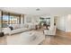 Comfortable living room with plush seating, views, and light colored floors at 4200 N Miller Rd # 504, Scottsdale, AZ 85251