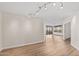 Open-concept living area with wood floors, neutral walls and recessed lighting at 4200 N Miller Rd # 504, Scottsdale, AZ 85251