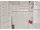 Well-organized storage room with white shelving units and ample space for various needs at 4200 N Miller Rd # 504, Scottsdale, AZ 85251