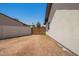 Large fenced backyard with an access gate and plenty of room for customization and entertainment at 4701 N 63Rd Dr, Phoenix, AZ 85033
