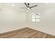 Bright bedroom featuring ceiling fan, recessed lighting, and a large window at 4701 N 63Rd Dr, Phoenix, AZ 85033