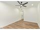 Bedroom with ceiling fan, light wood flooring, and fresh paint at 4701 N 63Rd Dr, Phoenix, AZ 85033