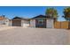 Beautiful home exterior with a gravel driveway, a well-manicured yard, and a charming modern design at 4701 N 63Rd Dr, Phoenix, AZ 85033