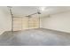 Spacious garage with epoxy flooring and an automatic door opener at 4701 N 63Rd Dr, Phoenix, AZ 85033