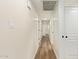 Hallway view showing multiple doorways and luxury vinyl floors at 4701 N 63Rd Dr, Phoenix, AZ 85033
