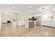 Stylish kitchen with stainless steel appliances, quartz countertops, and sleek white cabinetry at 4701 N 63Rd Dr, Phoenix, AZ 85033