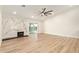 Bright living room showcasing a modern fireplace, wood floors, and sliding glass doors at 4701 N 63Rd Dr, Phoenix, AZ 85033