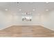 Spacious living room with ceiling fan, recessed lighting and light wood flooring at 4701 N 63Rd Dr, Phoenix, AZ 85033