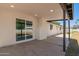 Outdoor patio featuring lighting, covered ceiling and sliding glass door entrance at 4701 N 63Rd Dr, Phoenix, AZ 85033