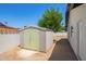Backyard shed, providing additional outdoor storage space for gardening tools and equipment at 4701 N 63Rd Dr, Phoenix, AZ 85033