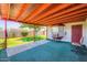 Cozy patio area with a lush lawn, a door and a vintage cooling appliance at 5343 W Coronado Rd, Phoenix, AZ 85035