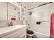 Well-lit bathroom features a shower and tub with sliding glass doors and vanity sink at 5343 W Coronado Rd, Phoenix, AZ 85035