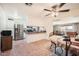 Bright kitchen features stainless steel appliances, a breakfast bar, and a dining area with tile flooring at 5343 W Coronado Rd, Phoenix, AZ 85035