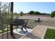 Community outdoor seating area with modern lounge chair and desert landscaping at 5705 W St Moritz Ln, Glendale, AZ 85306