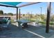 Community game area including ping pong table, bench seating and shade at 5705 W St Moritz Ln, Glendale, AZ 85306