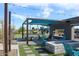Outdoor patio area with lounge area, ping pong table, and grilling area at 5705 W St Moritz Ln, Glendale, AZ 85306