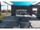 Community outdoor seating and grill area featuring ping pong table at 5705 W St Moritz Ln, Glendale, AZ 85306