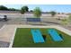Community recreation area featuring seating, artificial turf and lawn game at 5705 W St Moritz Ln, Glendale, AZ 85306