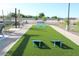 Community recreation area featuring cornhole, manicured synthetic grass and comfortable seating at 5705 W St Moritz Ln, Glendale, AZ 85306