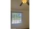 Bright bedroom with a window and fan at 602 N May St # 65, Mesa, AZ 85201