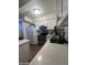 Well-lit kitchen featuring white cabinets and stainless steel appliances at 602 N May St # 65, Mesa, AZ 85201
