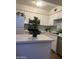 Bright kitchen features white cabinetry, stainless steel appliances, and light countertops at 602 N May St # 65, Mesa, AZ 85201