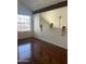 Spacious living room with hardwood floors, large window, and lofted wall at 602 N May St # 65, Mesa, AZ 85201