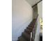Carpeted stairway with white railing leading to the upper level at 602 N May St # 65, Mesa, AZ 85201