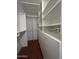 Organized walk-in closet with built-in shelves and drawers for optimal storage at 602 N May St # 65, Mesa, AZ 85201