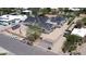 A construction project shows a multi-unit building with gray roofs and light siding surrounded by cars and fencing at 6426 E Turquoise Ave, Paradise Valley, AZ 85253