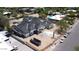 An aerial view shows a house under construction with a dark roof, light siding, and minimal landscaping at 6426 E Turquoise Ave, Paradise Valley, AZ 85253