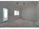 Empty bedroom space featuring natural light from one window and a door at 6426 E Turquoise Ave, Paradise Valley, AZ 85253