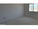 A simple bedroom with a window provides a blank canvas for customization at 6426 E Turquoise Ave, Paradise Valley, AZ 85253