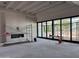 Unfinished living room with an empty fireplace and large sliding glass doors, ready for personalization at 6426 E Turquoise Ave, Paradise Valley, AZ 85253
