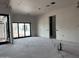 Bare living room showcases blank walls, a sliding door, and potential for bespoke design and layout at 6426 E Turquoise Ave, Paradise Valley, AZ 85253