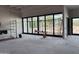 Spacious living room featuring large windows and unfinished flooring ready for customization at 6426 E Turquoise Ave, Paradise Valley, AZ 85253