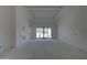 An airy living room with high ceilings and large windows offers abundant natural light at 6426 E Turquoise Ave, Paradise Valley, AZ 85253