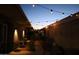 Evening shot of an outdoor patio with decorative string lights at 8848 N New World Dr, Glendale, AZ 85302