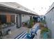 Cozy backyard patio featuring string lights, garden, and blue accent furniture at 8848 N New World Dr, Glendale, AZ 85302