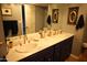 Bathroom featuring a vanity with double sinks, designer fixtures, and modern finishes at 8848 N New World Dr, Glendale, AZ 85302