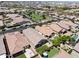 Aerial view showing the property and neighborhood with neatly manicured lawns and community features at 10165 E Gamma Ave, Mesa, AZ 85212