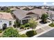 Aerial shot of a home nestled in a well-maintained suburban neighborhood featuring desert landscaping at 10165 E Gamma Ave, Mesa, AZ 85212