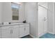 Elegant bathroom featuring a granite countertop vanity, white cabinets, and a glass-enclosed shower for a spa-like experience at 10165 E Gamma Ave, Mesa, AZ 85212