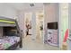 Bright bedroom featuring wood bunk beds and direct access to the walk-in closet at 10165 E Gamma Ave, Mesa, AZ 85212
