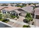 Charming single Gathering home with a well-manicured front yard and a two car garage at 10165 E Gamma Ave, Mesa, AZ 85212